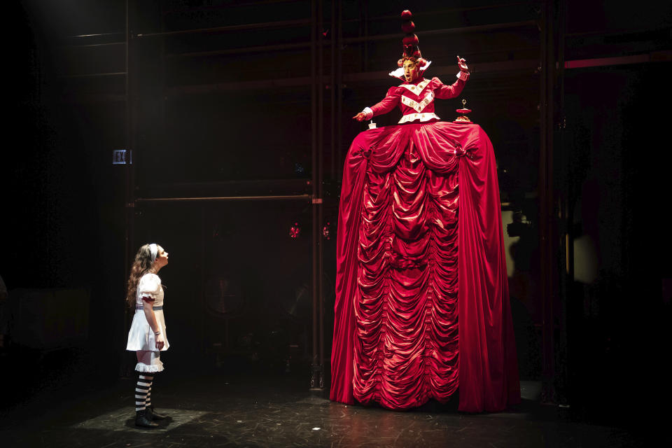 This image released by the Lookingglass Theatre Company shows Molly Hernàndez as Alice, left, and Kareem Bandealy as Red Queen during a performance of "Lookingglass Alice" in Chicago. The production will broadcast on PBS on Friday. (Liz Lauren/Lookingglass Theatre Company via AP)