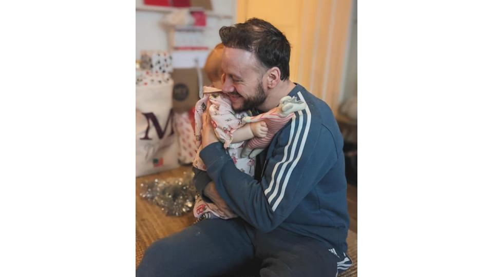 Kevin Clifton shared an adorable photo showing him hugging his daughter during her first Christmas