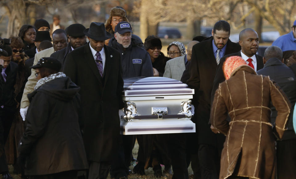 FILE - In this Feb. 9, 2013 file photo, the remains of 15-year-old Hadiya Pendleton are taken to her final resting place at the Cedar Park Cemetery in Calumet Park, Ill. Pendleton was shot and killed Jan. 29, 2013 in a park during a gang dispute she had nothing to do with about a mile from President Barack Obama’s Chicago home. First lady Michelle Obama attended the funeral with Senior White House Adviser Valerie Jarrett and Secretary of Education Arne Duncan. A year ago, the city’s bloodiest January in more than a decade had just ended. Since then, the number of homicides and other violent crimes that turned Chicago into a national symbol of gun violence have fallen sharply after the city and police changed strategies. (AP Photo/Charles Rex Arbogast, File)