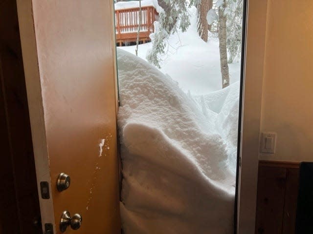 Snow blocks the kitchen doorway of Jennifer Cobb's house in Lake Arrowhead on Tuesday.