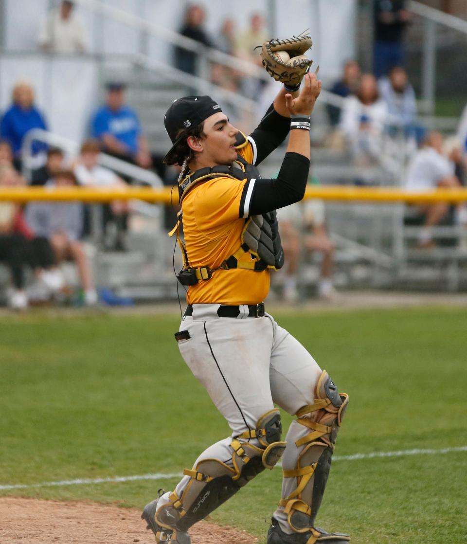 Penn junior Kydin Horvath catches a pop fly during a baseball game against Marian Monday, April 29, 2024, at Marian High School in Mishawaka.