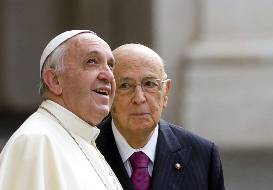 FILE - Italian President Giorgio Napolitano, right, stands next to Pope Francis as he looks up at the Vatican flag waving on the top of the Quirinale Presidential Palace on the occasion of their meeting in Rome, Thursday, Nov. 14, 2013. Giorgio Napolitano, the first former Communist to rise to Italy’s top job — president of the Republic — and the first president to be re-elected, has died Friday, Sept. 22, 2023. He was 98. (AP Photo/Alessandra Tarantino, File)