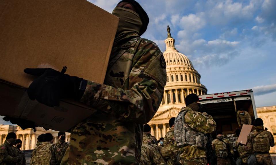 The National Guard prepare to protect Joe Biden’s inauguration, as fears grow of attacks by the far-right.