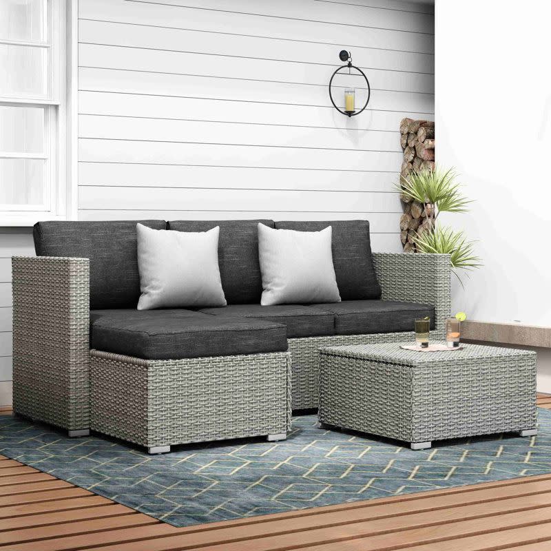 <p><a href="https://go.redirectingat.com?id=74968X1596630&url=https%3A%2F%2Fwww.wayfair.com%2F--%2Fpdp%2Fzipcode-design%25e2%2584%25a2--don-3-piece-rattan-sectional-seating-group-with-cushions-x115644486-l132-w004533375.html&sref=https%3A%2F%2F" rel="nofollow noopener" target="_blank" data-ylk="slk:Shop Now;elm:context_link;itc:0;sec:content-canvas" class="link ">Shop Now</a></p><p>Don Three-Piece Rattan Sectional</p><p>wayfair.com</p><p>$349.99</p>