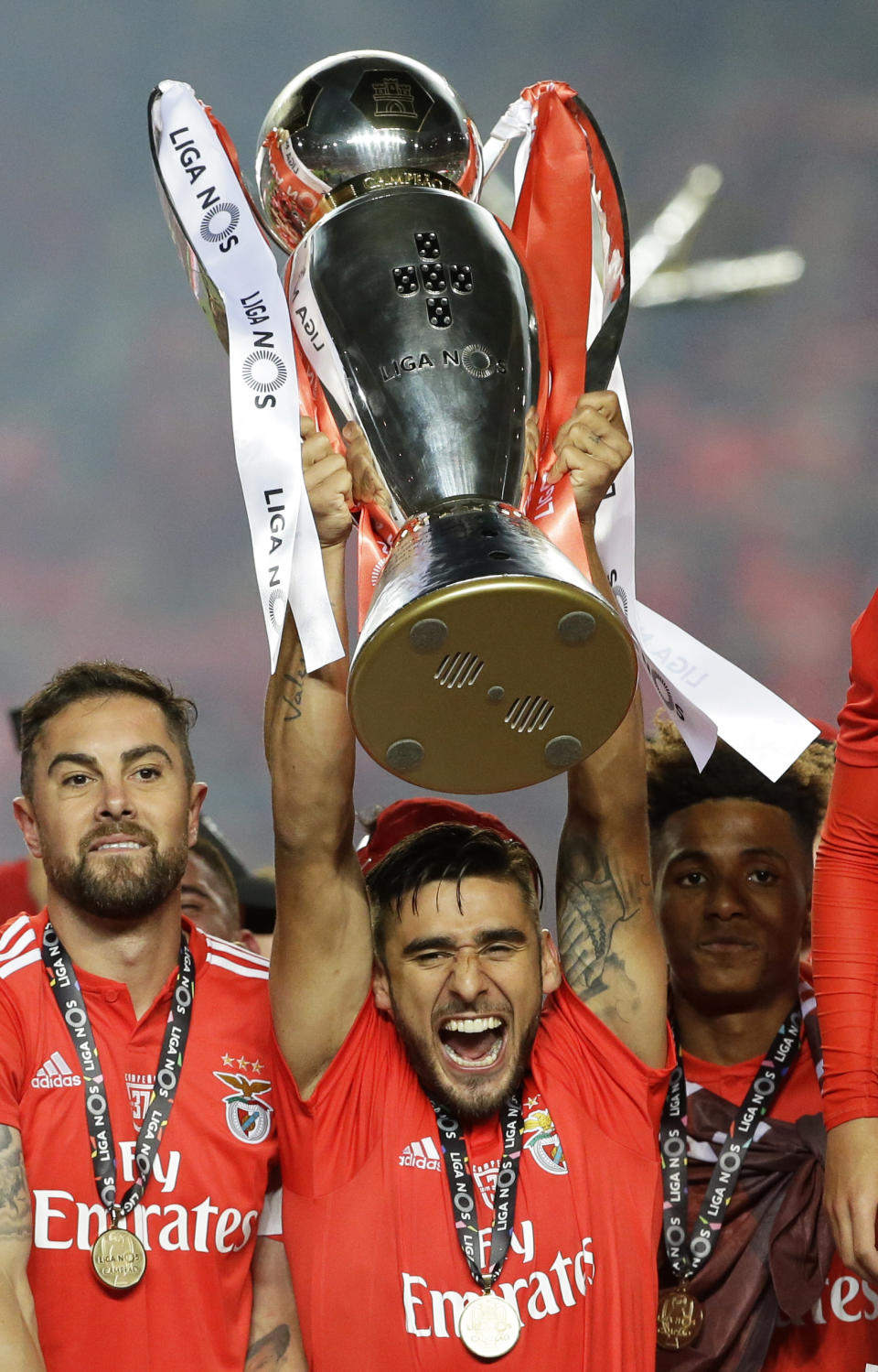 Benfica's Eduardo Salvio lifts the trophy after the Portuguese league last round soccer match between Benfica and Santa Clara at the Luz stadium in Lisbon, Saturday, May 18, 2019. Benfica won 4-1 to clinch the championship title. (AP Photo/Armando Franca)