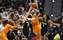 Connecticut's Anna Makurat (24) and Connecticut's Megan Walker (3) fight for a rebound with Tennessee's Tamari Key (20) in the second half of an NCAA college basketball game, Thursday, Jan. 23, 2020, in Hartford, Conn. (AP Photo/Jessica Hill)