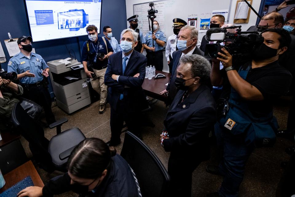 U.S. Attorney General Merrick Garland listens to a presentation alongside Sen. Dick Durbin (D-IL) and Chicago Mayor Lori Lightfoot while visiting the Chicago Police Department Strategic Decision Support Center on July 22, 2021 in Chicago, Illinois.