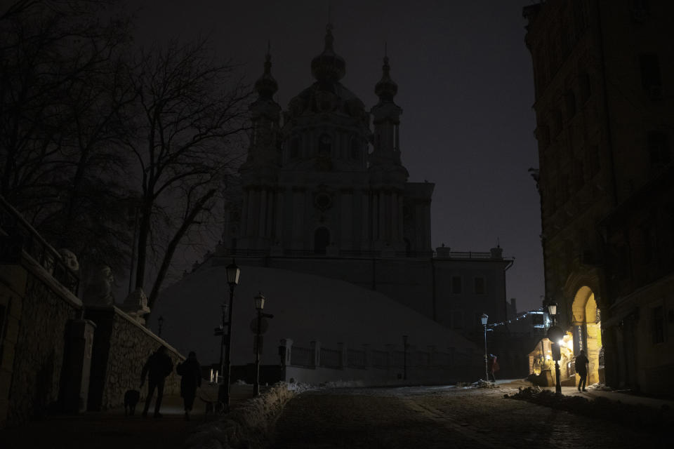 FILE - This photo shows a city center during a blackout after a Russian rocket attack in Kyiv, Ukraine, on Nov. 23, 2022. When Russian forces two months ago launched a military campaign against infrastructure in Ukraine, it opened an urgent second front far from the contact line: along power lines, water mains, and heating systems, and in places like homes, schools, offices and churches. (AP Photo/Andrew Kravchenko, File)