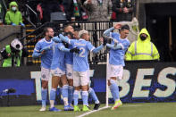 New York City FC midfielder Jesus Medina (19) is struck by an object thrown from the stands while celebrating his team's goal against Portland Timbers in the first half of the MLS Cup soccer match Saturday, Dec. 11, 2021, in Portland, Ore. (AP Photo/Amanda Loman)