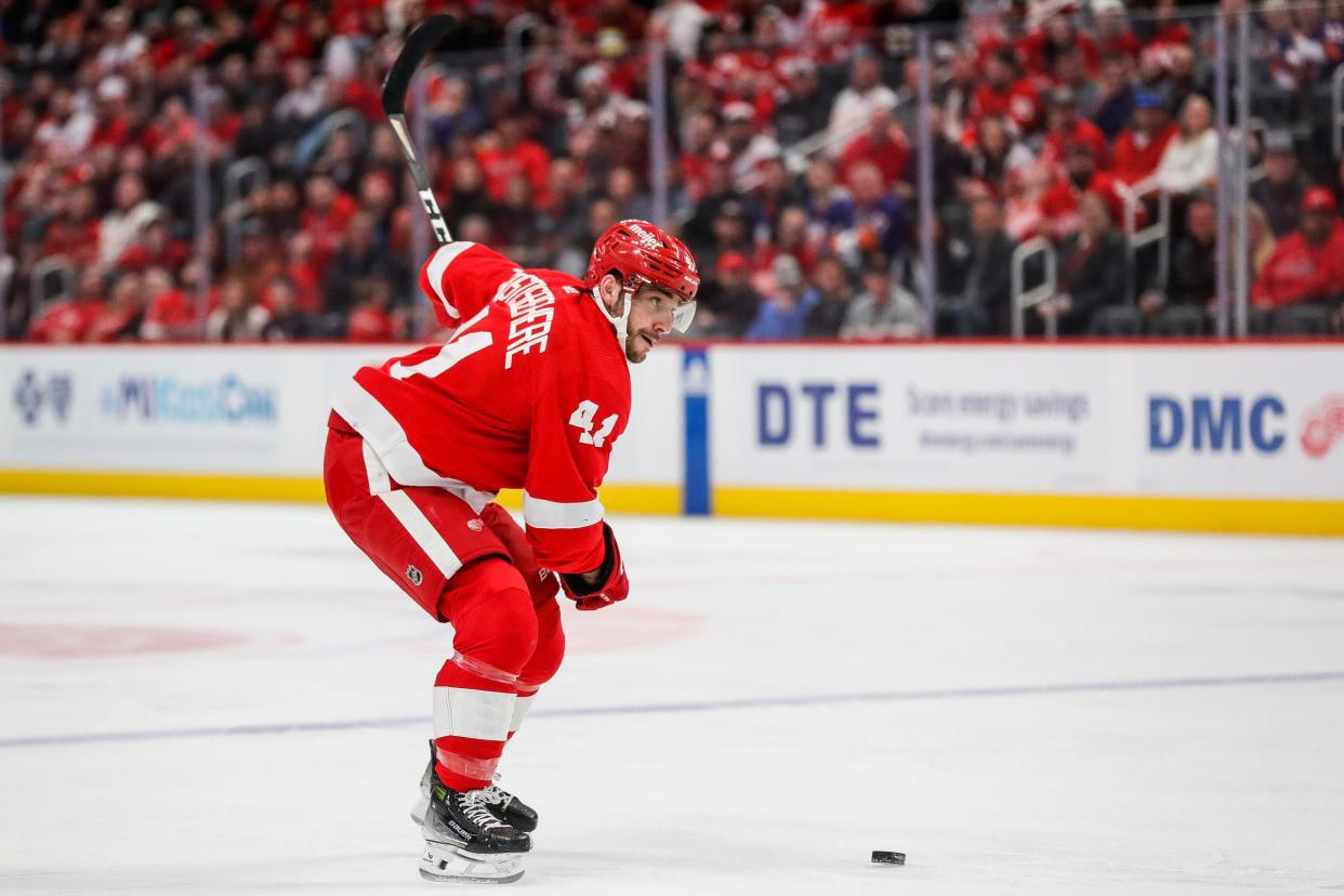Red Wings defenseman Shayne Gostisbehere looks to shoot the puck against the Islanders during the third period of the Wings' 5-3 loss on Thursday, Feb. 29, 2024, at Little Caesars Arena.