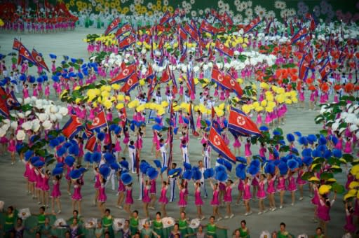 This year's 'Grand Mass Gymnastics and Artistic Performance', titled "The Land of the People", had its premiere on Monday and was expected to run until October