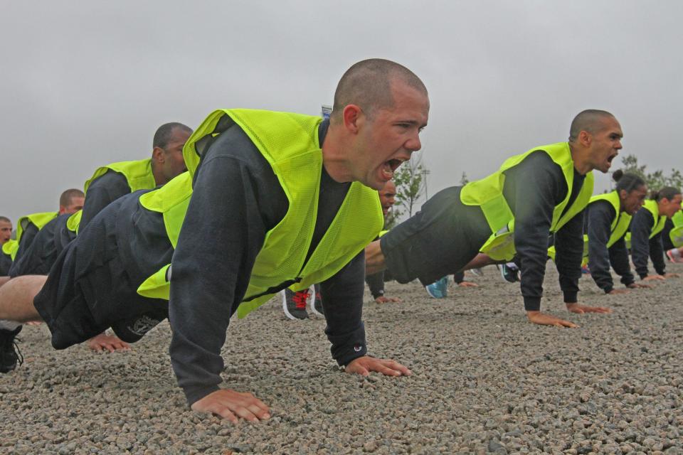 Providence police recruits do pushups during training in 2017. Some experts are calling for police departments to rethink the recruitment process, to make it more candidate-centered and in line with the private sector.