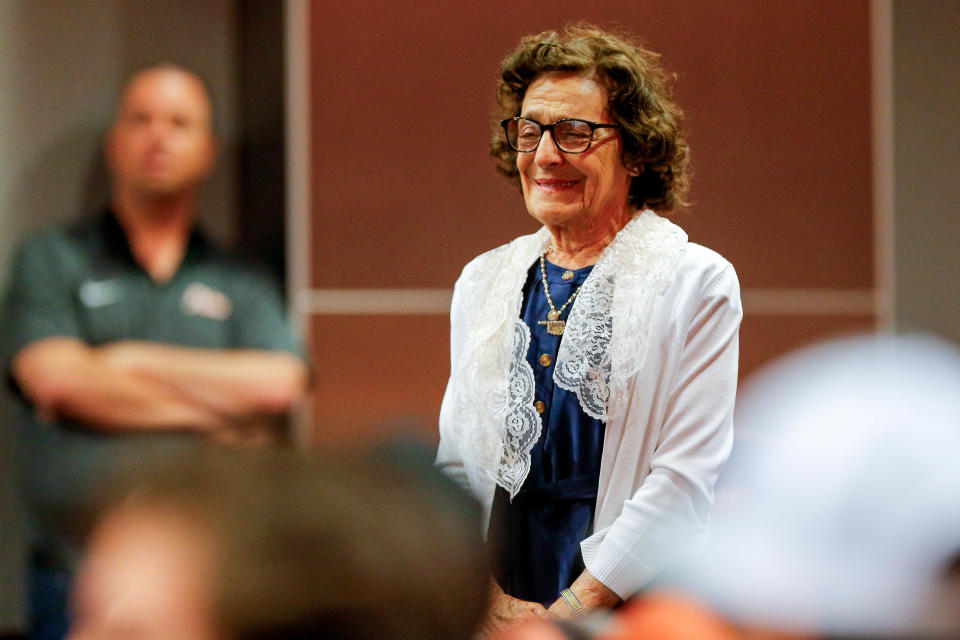 OSU wrestling coach John Smith’s mother, Madeline Smith, stands during Monday's new conference in Stillwater as the longtime coach credited her toughness.