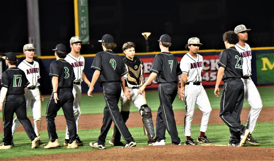 South Walton (black) and Tate (white) go through the postgame hand-shake line following the Aggies' 8-3 victory on Thursday, March 23, 2023 from Blue Wahoos Stadium.`