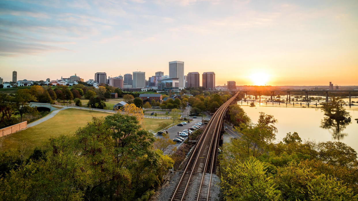 Downtown Richmond, Virginia skyline and the James River at twilight.