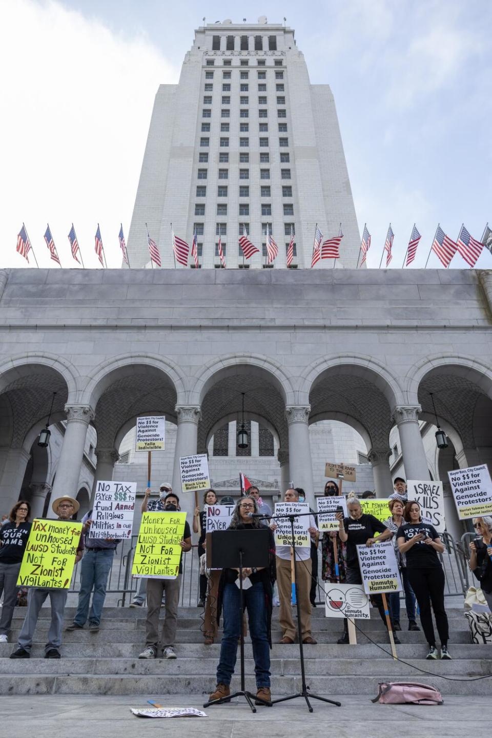 A group of speakers voices opposition at City Hall in Los Angeles.