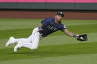 Seattle Mariners right fielder Tim Lopes dives to catch a fly ball from Houston Astros' Alex Bregman in the first inning of a baseball game Monday, Sept. 21, 2020, in Seattle. (AP Photo/Elaine Thompson)