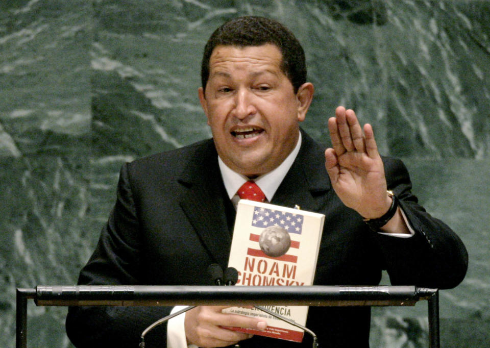 FILE - In this Sept. 20, 2006 file photo, Venezuelan President Hugo Chavez holds a Spanish language version of Hegemony or Survival: America's Quest for Global Dominance by Noam Chomsky while addressing the 61st session of the United Nations General Assembly at U.N. headquarters. The late Venezuelan leader drew gasps at the U.N. in 2006 when he said of U.S. President George W. Bush, "Yesterday, the devil came here," adding that the podium "still smells of sulfur." The U.S. was at the time heavily embroiled in the Iraq War, which Chavez had vehemently opposed. (AP Photo/Julie Jacobson, File)