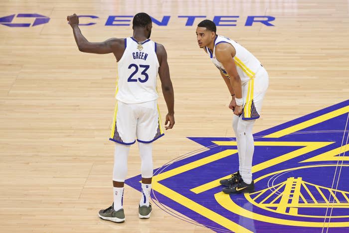 Draymond Green #23 talks to Jordan Poole #3 of the Golden State Warriors during Game One of the 2022 NBA Finals