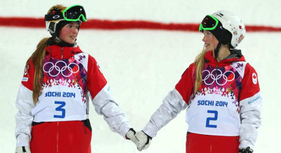 The iconic photo: Sisters Justine (R) and Chloe Dufour-Lapointe celebrate their gold and silver medals at the 2014 Olympic Winter Games. (Getty Images)