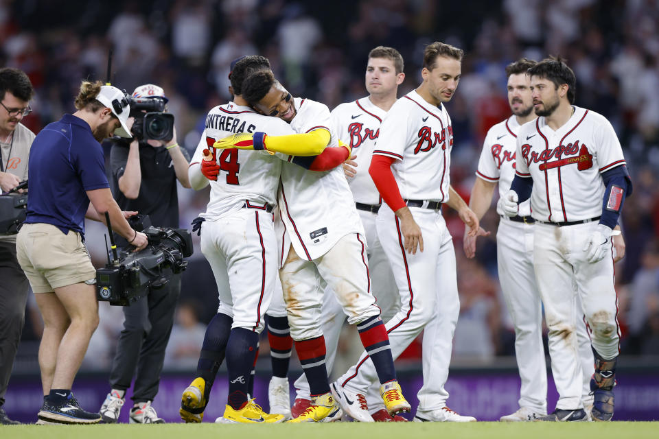Atlanta Braves William Contreras (24) reacts with Ronald Acuna Jr. after his game winning single in the ninth inning of a baseball game against the Philadelphia Phillies, Tuesday, May 24, 2022, in Atlanta. (AP Photo/Todd Kirkland)