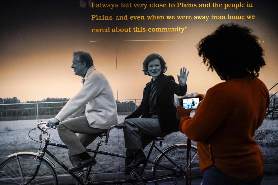 Brianna Cook, of Macon, Ga., looks at a display inside the Jimmy Carter National Historical Park, Monday, Nov. 20, 2023, in Plains, Ga. Rosalynn Carter, the closest adviser to Jimmy Carter during his one term as U.S. president and their four decades thereafter as global humanitarians, died Sunday, Nov. 19, 2023. She was 96. (AP Photo/Mike Stewart)