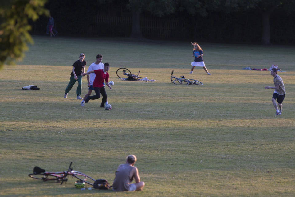 As the UK Coronavirus pandemic lockdown continues but with restrictions easing, south Londoners enjoy the last weekend sunshine by playing football and throwing a frisbee in Ruskin Park, a public green space in Lambeth, on 14th June 2020, in London, England. (Photo by Richard Baker / In Pictures via Getty Images)