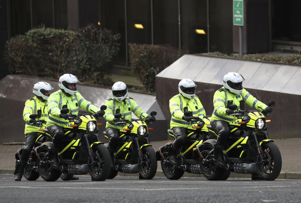 Police officers on electric motorbikes ahead of a march by climate activists through the streets of Glasgow, Scotland, Friday, Nov. 5, 2021 which is the host city of the COP26 U.N. Climate Summit. The protest was taking place as leaders and activists from around the world were gathering in Scotland's biggest city for the U.N. climate summit, to lay out their vision for addressing the common challenge of global warming. (AP Photo/Scott Heppell)