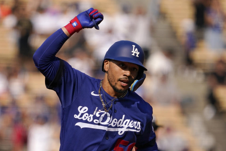 Los Angeles Dodgers' Mookie Betts gestures before rounding third after hitting a solo home run during the third inning of a baseball game against the San Francisco Giants Saturday, July 23, 2022, in Los Angeles. (AP Photo/Mark J. Terrill)