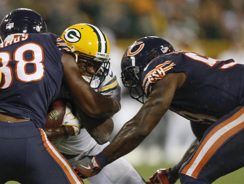 The hit that Danny Trevathan (R) delivered to Davante Adams knocked out the Packer from the game. (AP)