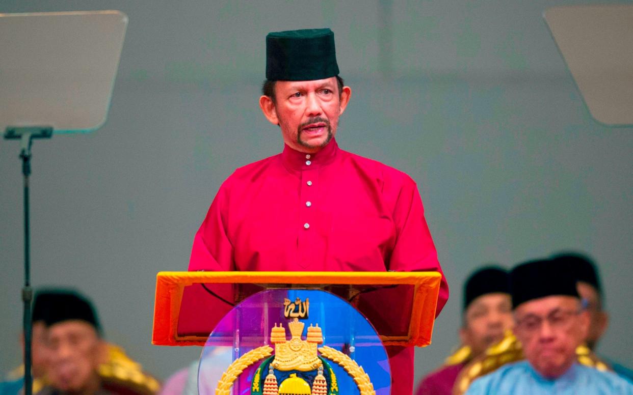 Brunei's Sultan Hassanal Bolkiah delivers a speech ahead of the new law coming into force - AFP