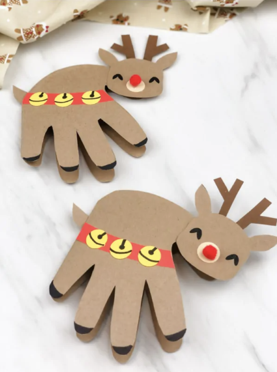 <p>Excite both children and adults with these lovable reindeer cards. Start with a child's handprint, then decorate it with a red harness, brown antlers and a red pom-pom nose. </p><p><a href="https://www.simpleeverydaymom.com/handprint-reindeer-card/" rel="nofollow noopener" target="_blank" data-ylk="slk:Get the tutorial from Simple Everyday Mom »;elm:context_link;itc:0;sec:content-canvas" class="link "><em>Get the tutorial from Simple Everyday Mom »</em></a></p>