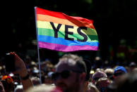 Supporters of the 'Yes' vote for marriage equality celebrate after it was announced the majority of Australians support same-sex marriage in a national survey, paving the way for legislation to make the country the 26th nation to formalise the unions by the end of the year, at a rally in central Sydney, Australia, November 15, 2017. REUTERS/David Gray