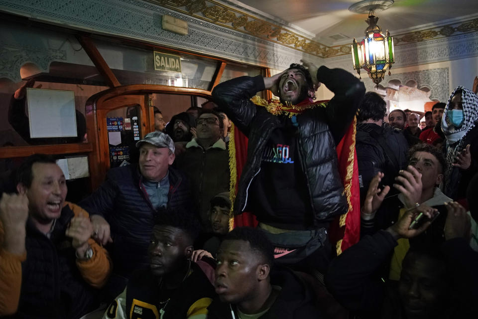 Morocco fans react as they watch the World Cup semifinal match against France, in Madrid, Spain, Wednesday, Dec. 14, 2022. (AP Photo/Andrea Comas)