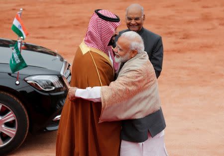 Saudi Arabia's Crown Prince Mohammed bin Salman is greeted by India's Prime Minister Narendra Modi as President Ram Nath Kovind watches during his ceremonial reception at the forecourt of Rashtrapati Bhavan in New Delhi, India, February 20, 2019. REUTERS/Adnan Abidi