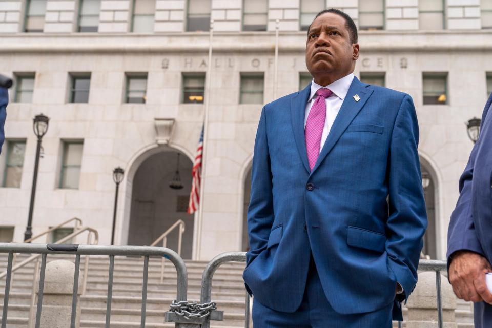 Conservative radio talk show host Larry Elder speaks to supporters during a campaign stop outside the Hall of Justice downtown Los Angeles Thursday, Sept. 2, 2021.