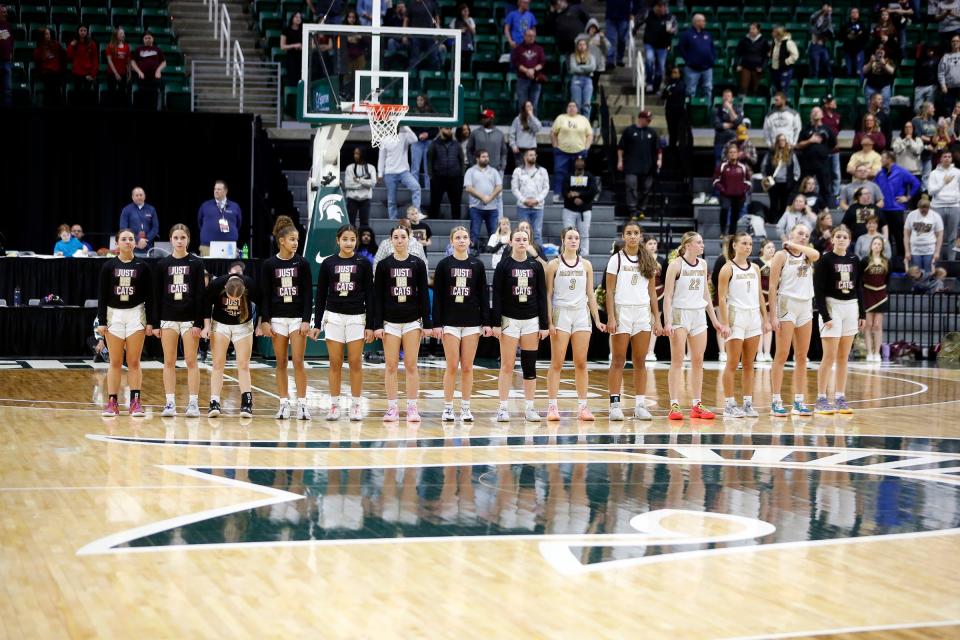 The Brandywine team lines up for the national anthem before the MHSAA Division 3 girls basketball state championship game Saturday, March 23, 2024, at the Breslin Center in East Lansing, Mich.