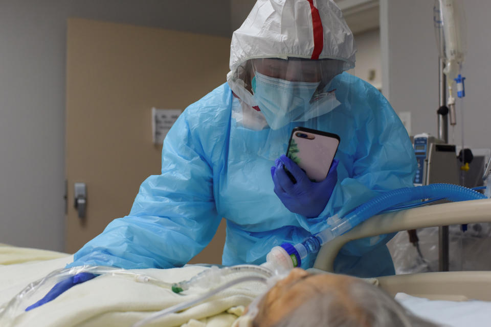 While FaceTiming her siblings, Angelica Mendez, 48, says goodbye to her mother, Catalina Salazar, 86, who was struggling to fight the coronavirus disease (COVID-19) and who died later in the day, at United Memorial Medical Center in Houston, Texas on September 8, 2020.  (Callaghan O'Hare/Reuters)