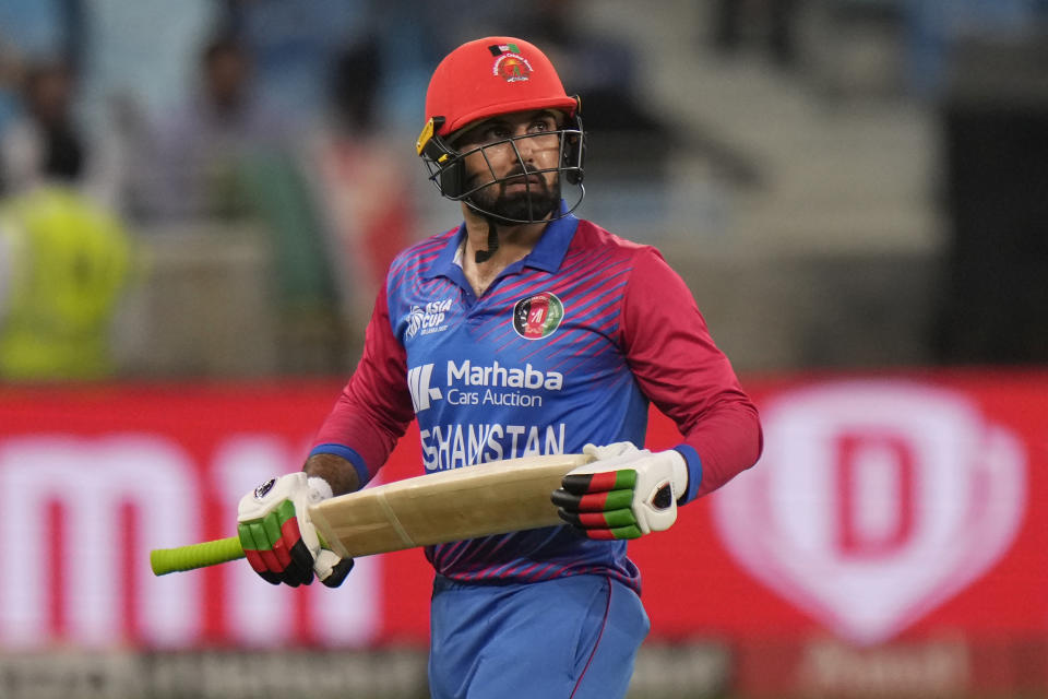 Afghanistan's captain Mohammad Nabi reacts as he walks off the field after losing his wicket during the T20 cricket match of Asia Cup between India and Afghanistan, in Dubai, United Arab Emirates, Thursday, Sept. 8, 2022. (AP Photo/Anjum Naveed)