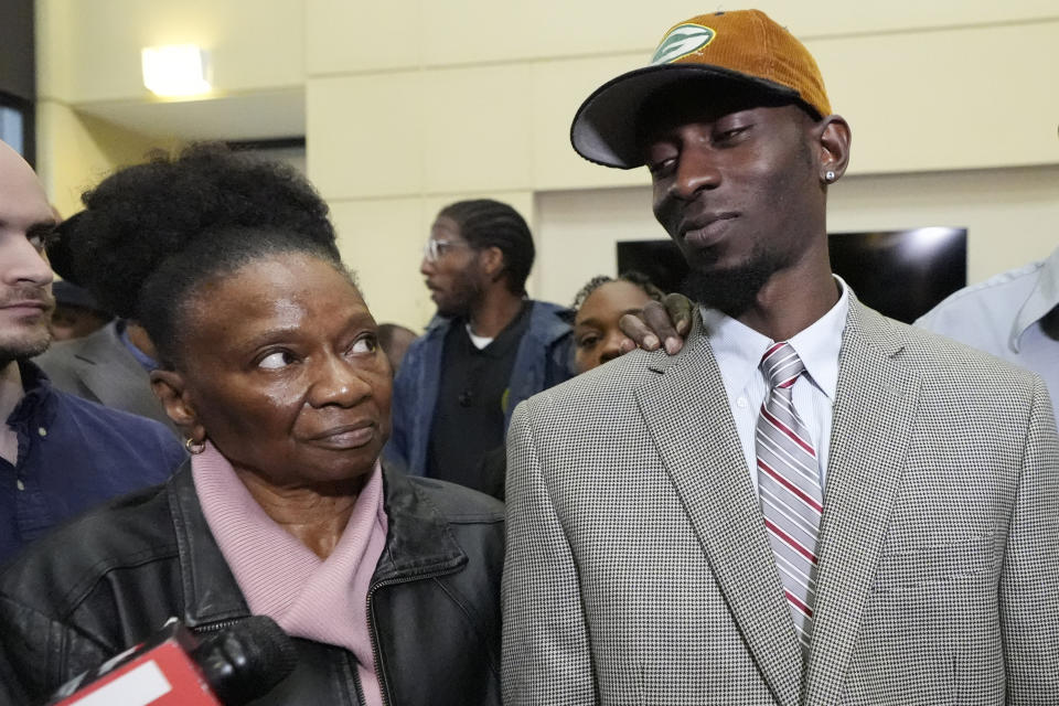 Michael Corey Jenkins, right, stands with his mother Mary Jenkins, following the sentencing of six former Mississippi law enforcement officers for the racially motivated torture of Jenkins, and his friend, Eddie Terrell Parker, Wednesday, April 10, 2024, in Brandon, Miss. Rankin County Circuit Judge Steve Ratcliff gave the six former Mississippi law enforcement officers yearslong state sentences that were shorter than the amount of time in federal prison that they had already received. Time served for the state convictions will run concurrently, or at the same time, as the federal sentences, and the men will serve their time in federal penitentiaries. (AP Photo/Rogelio V. Solis)