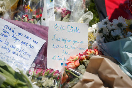 Flowers are left outside Tottington high school, in memory of pupil Olivia Campbell who was killed during the Manchester Arena attack, Bury, Manchester, Britain, May 26, 2017. REUTERS/Andrew Yates