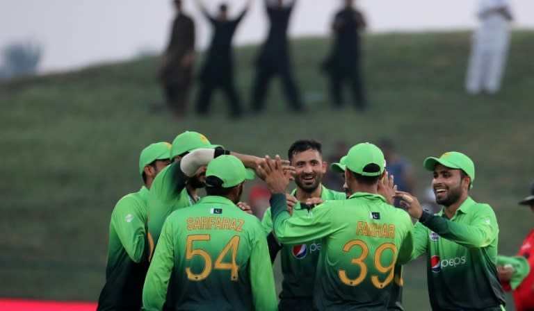 Pakistan team celebrate at Zayed Cricket Stadium on October 18, 2017