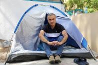 Omid Tootian, an Iranian musician, sits in a tent inside the UN buffer zone at Ledra Palace in Nicosia