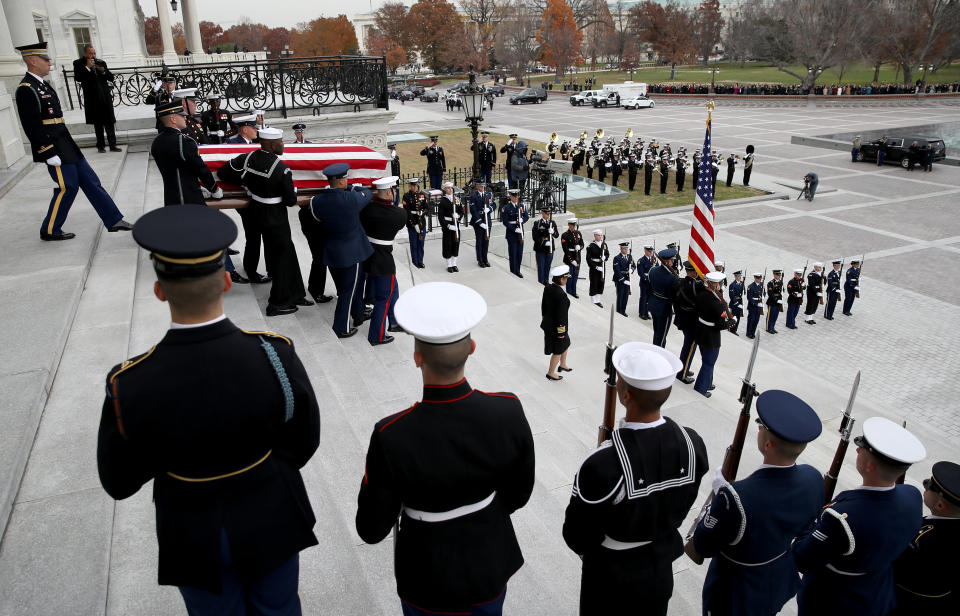 A U.S. military honor guard team carries the flag draped casket of former President George H.W. Bush from the U.S. Capitol, Dec. 5, 2018 in Washington, D.C. (Photo:Win McNamee/Pool via ReutersThe flag-draped casket of former President George H.W. Bush is carried by a joint services military honor guard from the U.S. Capitol, Wednesday, Dec. 5, 2018, in Washington, D.C. (Photo: Alex Brandon/Pool via Reuters)