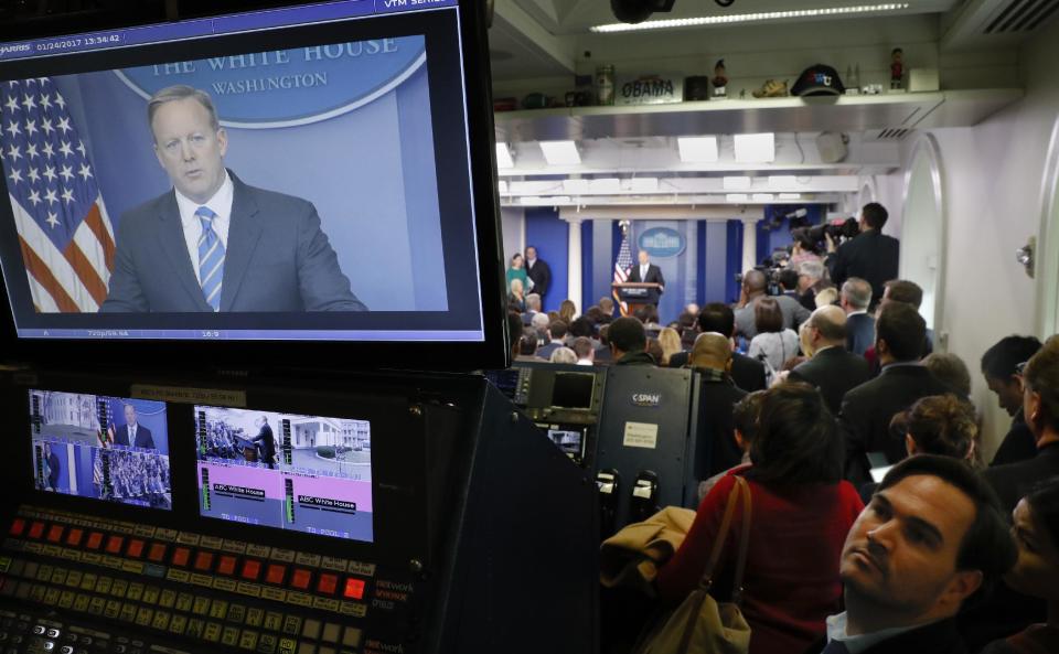 White House Press secretary Sean Spicer is seen on television broadcast monitors as he speaks to the media during the daily briefing in the Brady Press Briefing Room of the White House in Washington, Tuesday, Jan. 24, 2017. (AP Photo/Pablo Martinez Monsivais)