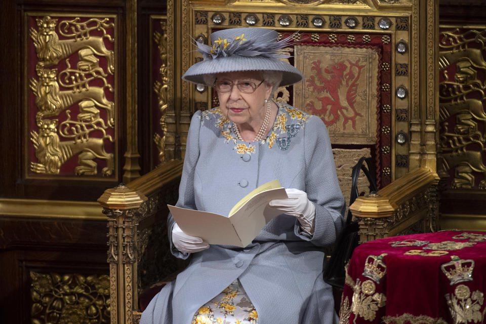 Britain's Queen Elizabeth II reads the Queen's Speech on the The Sovereign's Throne in the House of Lords chamber,, during the State Opening of Parliament at the Houses of Parliament in London on May 11, 2021, which is taking place with a reduced capacity due to Covid-19 restrictions. - The State Opening of Parliament is where Queen Elizabeth II performs her ceremonial duty of informing parliament about the government's agenda for the coming year in a Queen's Speech. (Photo by Eddie MULHOLLAND / POOL / AFP) (Photo by EDDIE MULHOLLAND/POOL/AFP via Getty Images)