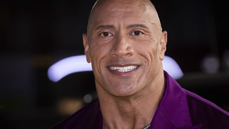 Dwayne Johnson, aka The Rock, poses for photographers upon arrival for the premiere of the film “Black Adam” on Tuesday, Oct. 18, 2022, in London.