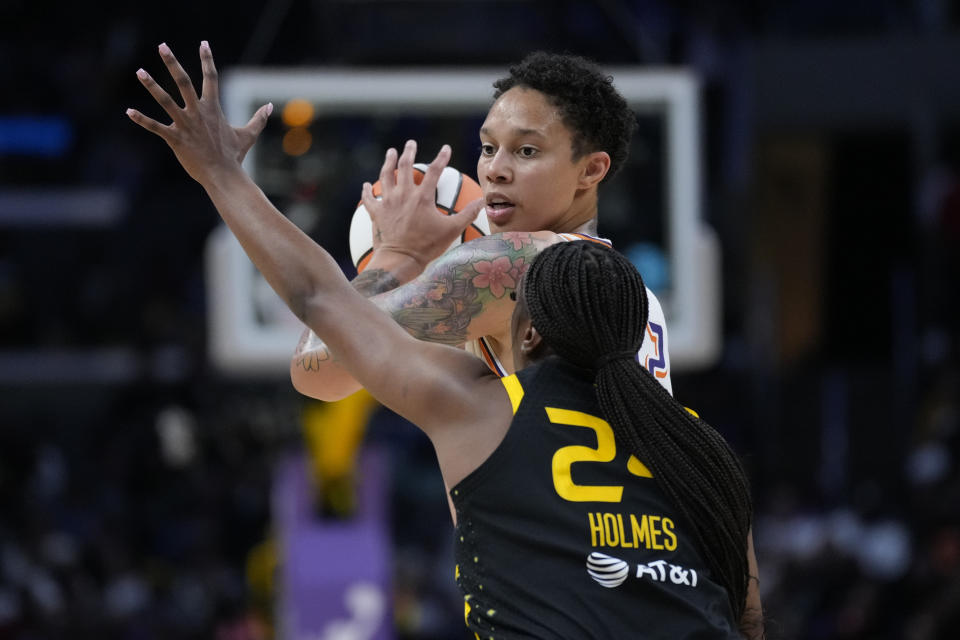 Phoenix Mercury center Brittney Griner controls the ball against Los Angeles Sparks forward Joyner Holmes during the season opener on Friday at Crypto.com Arena in Los Angeles. (AP Photo/Ashley Landis)