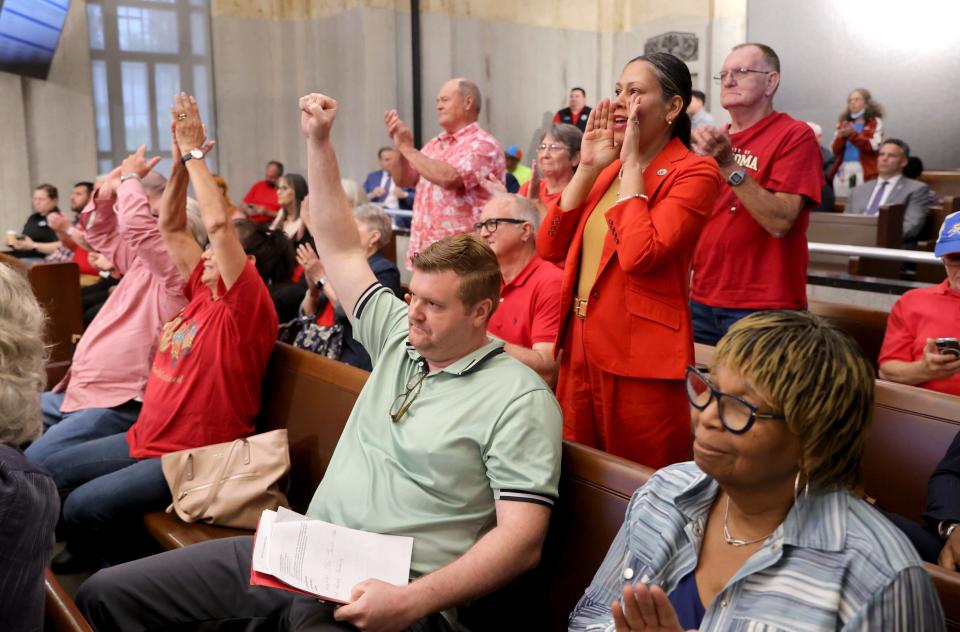 Residents cheer Tuesday after the Oklahoma County jail site was not approved during the Oklahoma City Council.