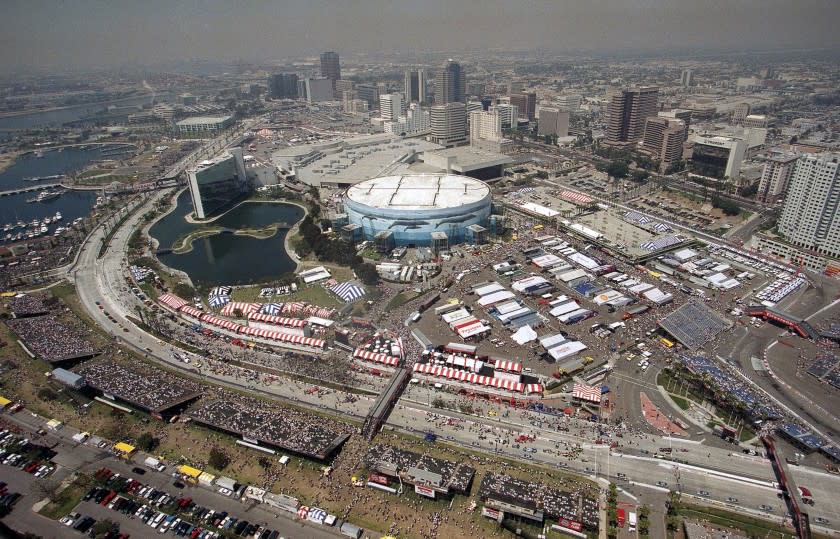 FILE - In this April 18, 1999, file photo, drivers prepare for the Grand Prix of Long Beach auto race in Long Beach, Calif. Long Beach is the unicorn of motorsport events in that its crowd has grown while events pretty much everywhere else are still trying to stop the slide. Long Beach organizers say a three-day crowd of 185,000 attended the race in 2018, the most since 2000. (AP Photo/John Robinson, File)